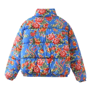 Detail of floral and phoenix print on the back of a blue ethnic quilted jacket