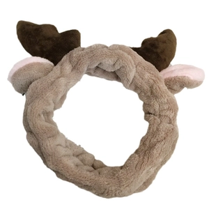 Cute beige plush reindeer antler headband with brown antlers and pink ears for winter