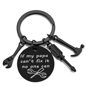 Detail of matte black stainless steel keychain with mini tools and engraved father's gift plate