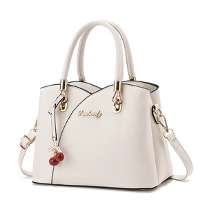 Elegant white PU leather tote bag with top handles and a decorative cherry charm