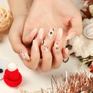 Christmas press on nails with reindeer and candy cane patterns in long coffin shape