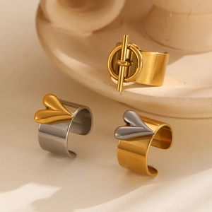 Two-tone stainless steel open ring featuring heart and OT buckle designs in gold and silver