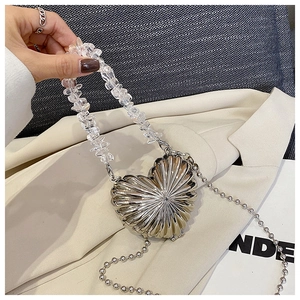 Silver heart shaped shell textured mini handbag with crystal beaded handle detail