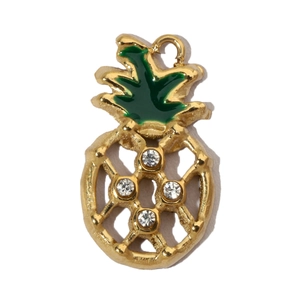 Detail of gold pineapple charm with green enamel leaves and sparkling crystal rhinestones