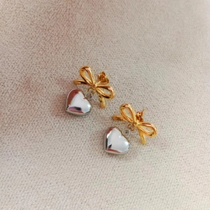 Elegant 18K gold bow and silver heart pendant earrings in high-polished stainless steel