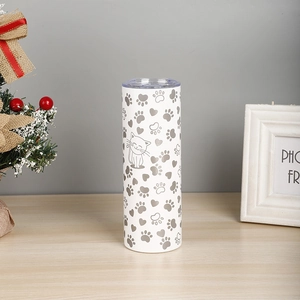 Close-up of a white 20oz stainless steel travel mug with silver cat and heart patterns