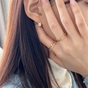 925 silver gold lock earrings and zircon rings set shown on model in warm lighting
