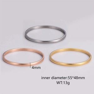 Detailed view of three 4mm oval metal bangles in gold, silver, and rose gold finishes