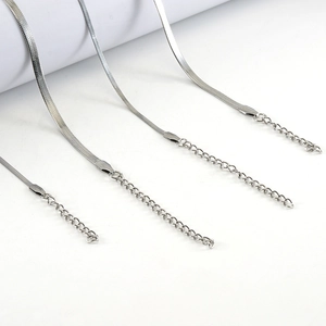 Detailed view of silver flat snake bone chains with lobster clasps and extension links