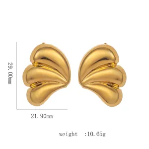 Detail view showing 18k gold plated geometric fan earrings with wave texture and dimensions