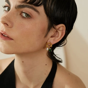 French crystal and pearl 18k gold plated stainless steel earrings worn by a model