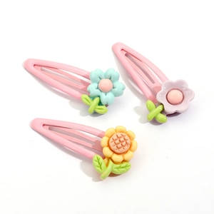 Three cute floral snap hair clips for girls with pastel resin flowers on pink metal bases