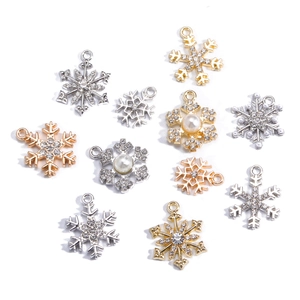 Detailed collection of crystal snowflake pendants in gold, silver, and rose gold finishes