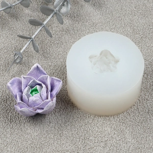 Macro detail of translucent silicone succulent flower mold and purple resin craft model