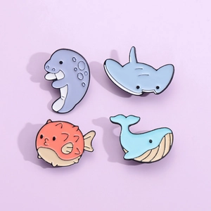 Cartoon marine animal enamel pins set featuring whale, seal, pufferfish and ray badges