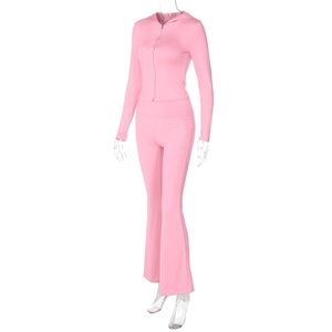 Side view of pink long sleeve zip-up hooded jacket and high waist flared pant set