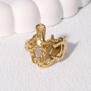 Irregular baroque stainless steel ring with a liquid lava texture in gold finish