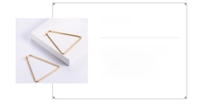 Detail view of large 18k gold-plated 316L titanium steel triangle earrings 55x60mm