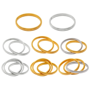Macro shot of elastic metal sleeve holders in gold and silver finishes in various sets