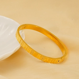 Luxurious 18k gold plated stainless steel bangle with classic Greek key relief pattern