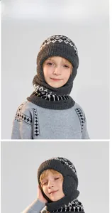 Kids' winter knit beanie and scarf set with Nordic pattern worn by child model