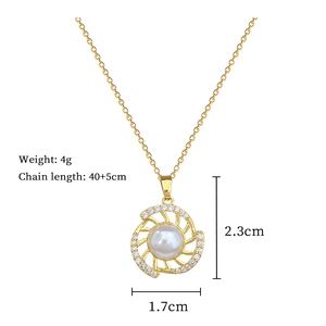 Detailed view of a gold titanium necklace with a rotatable pearl and diamond pendant