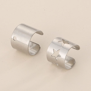 Surgical steel ear cuffs featuring cutout star and circular hole designs in silver finish