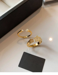 Close-up of gold plated adjustable rings with star motifs and pavé cubic zirconia