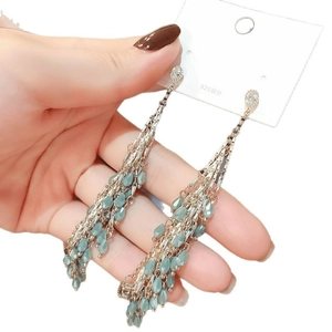 Bohemian 925 silver needle earrings with light green glass teardrops and long tassels