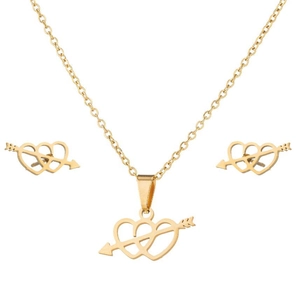 Macro shot of gold double heart arrow pendant necklace and stud earrings set