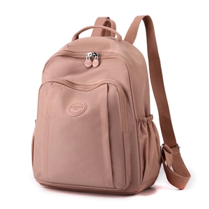Minimalist pink nylon backpack for women featuring large capacity and a stylish lightweight design