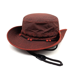Detail of dark reddish-brown outdoor sun hat with wide brim and adjustable chin strap