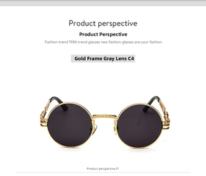 Detail view of round steampunk sunglasses with gold metal frame and ornate carvings