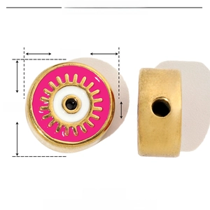 Detailed view of 12mm golden stainless steel bead with pink enamel and evil eye pattern