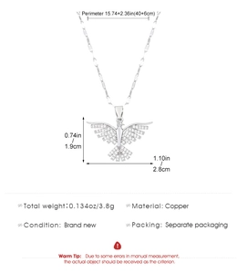 Detail view of a gold phoenix necklace with dimensions 1.9cm by 2.8cm and crystal accents