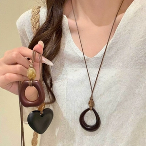 Handmade wax cord necklace with geometric resin wood pendants in forest retro style