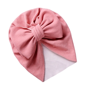 Pink newborn baby hat featuring a double layered bow in soft thermal cashmere style