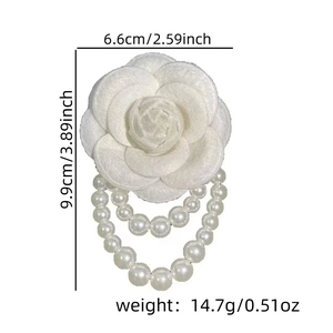 Detail view of pearl camellia brooch with dimensions 6.6x9.9cm and weight 14.7g