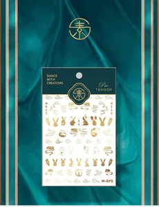 Macro shot of M-075 golden 3D nail stickers featuring rabbit and cloud patterns