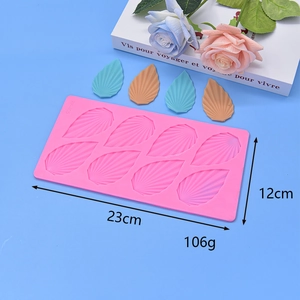 Pink silicone mold for 8 leaf-shaped chocolate or wax wings, 23cm by 12cm size