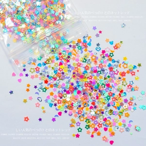Colorful mix of star and heart shaped glitter sequins for DIY nail art decoration