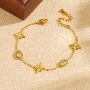 Elegant gold-plated stainless steel star bracelet with sparkling oval crystal charms