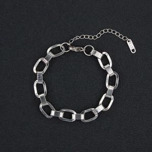 Close-up of silver titanium chain bracelet with oval links and K18 hallmark detail