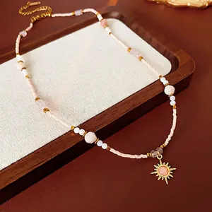 18K gold plated sunflower pendant necklace with pink beaded chain and vintage sunburst charm