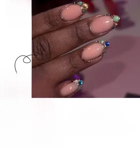 Short almond press-on nails in nude pink featuring colorful rhinestones style JP3322