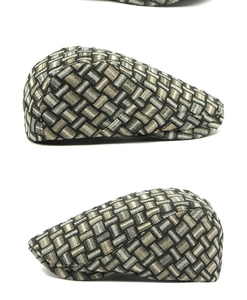 Macro detail of retro plaid beret cap with woven jacquard texture and classic grey checks