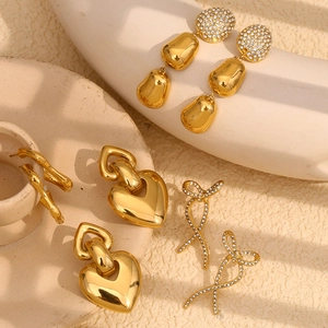 Detailed set of gold plated earrings featuring heart, bow, and teardrop designs