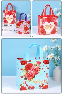 Detail of Happy Mother's Day gift bags with vibrant red rose patterns and sturdy handles