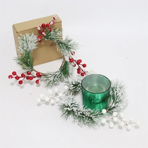 Minimalist Christmas candle ring wreath with white cedar needles and red berries
