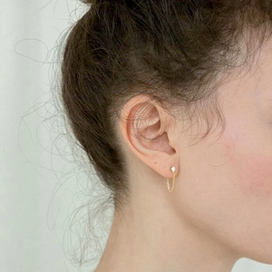 S925 silver needle chain earrings with crystal stud on female ear in daily lifestyle view